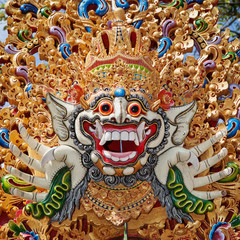 Traditional Barong mask pattern in temple - protective spirit, Bali island symbol. Featured in Balinese dances and ceremonies. Culture, religion, Arts festivals of Indonesian people. Travel background