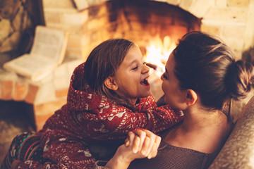 By the fireplace