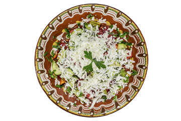 Bulgarian Shopska salad isolated on white