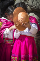 Native people from peruvian city dressed in colorful clothing. Peru, South America.