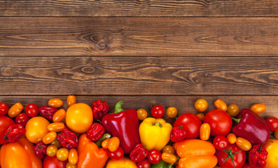 Colorful vegetables harvest on wooden background