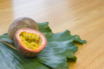 Passion fruits on wooden background