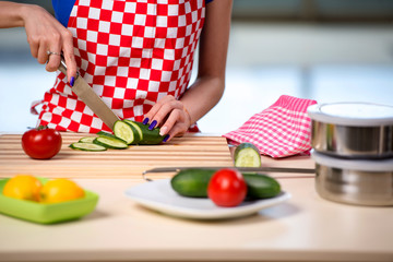 Woman preparing salad in the kitchen