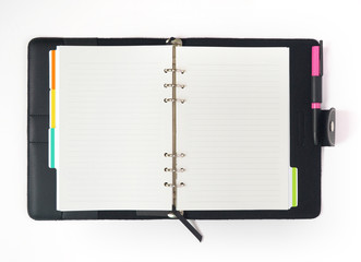 leather notebook with spiral, colorful tabs, pencil and blank lined paper