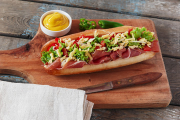 sandwich baguette ham jamon cheese with tomato and herbs