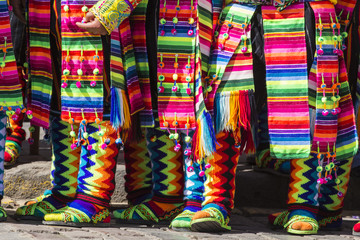 Peruvian dancers at the parade in Cusco. People in traditional clothes.