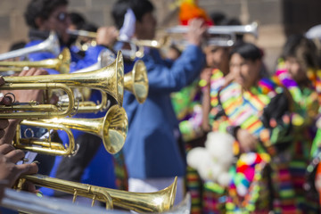 Unknown musicians of a brass band on parade in Cuzco, Peru