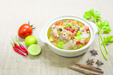 Oxtail soup in white dish on brown tablecloth/ Halal food