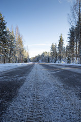 A wintry road covered with slush. Dangerous to drive.
