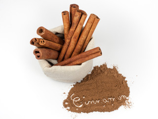 Bunch of cinnamon sticks in a canvas bag and 
