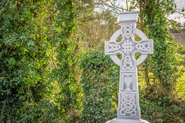 Old white stone celtic cross. Background with copy space for text