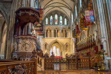 Fototapeta na wymiar The interior of the St Patrick's Cathedral, the Church of Ireland. The pulpit, choir and sanctuary.