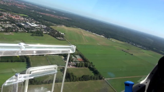 Cockpit point of view POV footage in modern glider sailplane turning camera towards the advanced instrument panel with gauges for reading altitude airspeed ascending speed beautiful day blue sky 4k