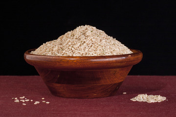 Bowl of raw brown rice.
