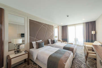 Modern hotel room with big bed