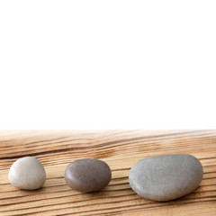 Stones and wooden background
