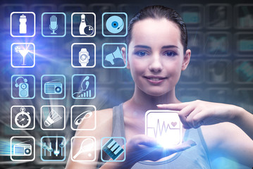 Young girl in sports concept pressing virtual buttons