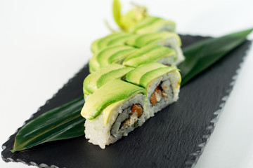 Avocado sushi roll - salmon, cheese philadelphia, caviar 