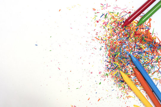 Wax paints in bright colors on white isolated background with copy space