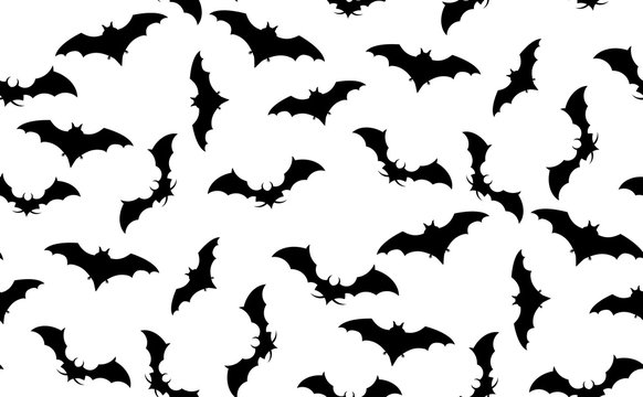 Vector seamless pattern of bats. The texture of bats located randomly