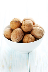 Walnuts on a blue wooden table
