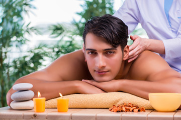 Fototapeta na wymiar Man during massage session in spa salon