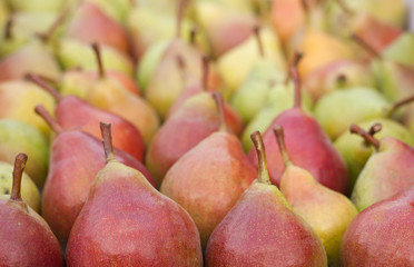 pears on the counter market as background