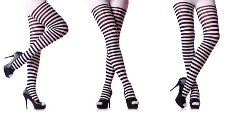 Legs with striped stockings isolated on white © Elnur