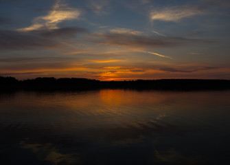 Majestic red sunset and its reflection in river
