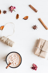 Fototapeta na wymiar Autumn. Hot chocolate, knitted blanket, gift, dried flowers and