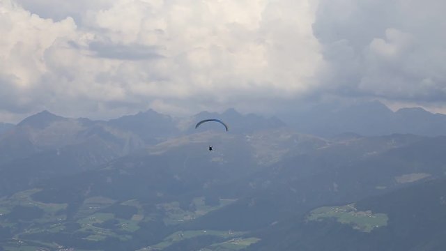 Parachutist - 
paratrooper on the Alps landscape