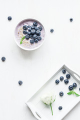Healthy breakfast with yogurt, muesli and blueberry. Top view, f