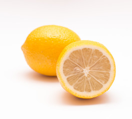 Fototapeta na wymiar Two lemons on a light background