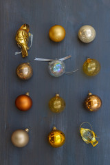 Christmas golden decorations on dark wooden background