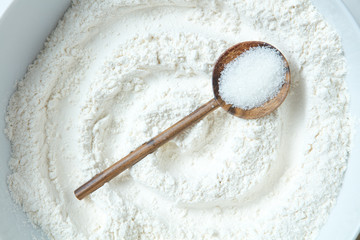 Sugar in a wooden spoon