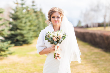 bride holding beautiful wedding bouquet