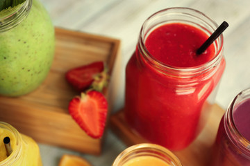 Refreshing fruit smoothie on table