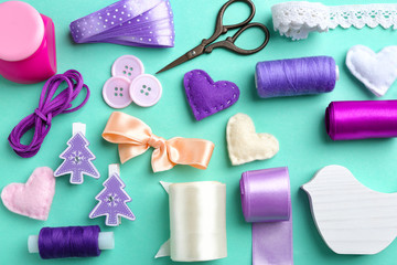 Fototapeta na wymiar Flat lay of handcraft in purple tones on colour background