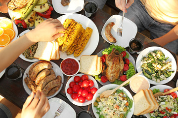 Friends eating on picnic