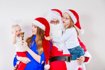 Happy family together with Santa Claus.