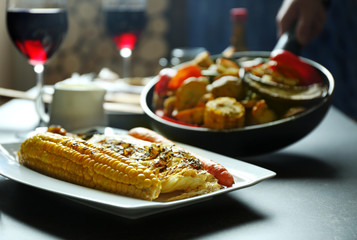 Delicious dinner with grilled vegetables and wine