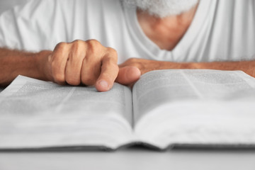 Old man reading the Bible