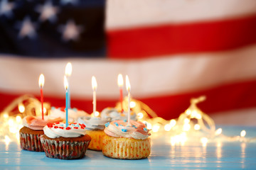 Naklejka na ściany i meble Cupcakes on blurred American flag background