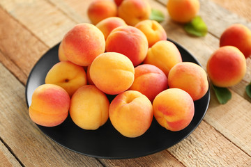 Fresh apricots on plate