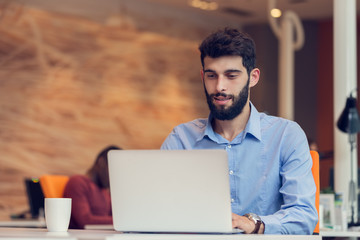 startup business, software developer working on computer at modern office