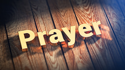 Word Prayer on wood planks