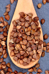 Buckwheat in a wooden spoon