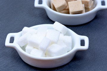 Sugar cubes in a ceramic bowls