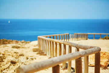 Wooden walkway along the coastline in Algarve region