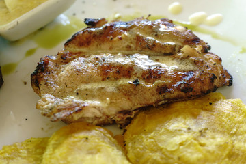 roast chicken plate with tostones